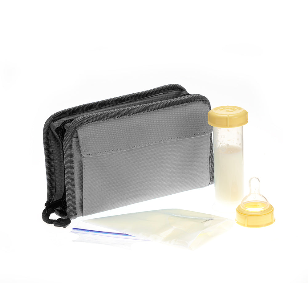 FlexiFreeze refreezable breastmilk pocketbook cooler, charcoal, next to formula and a container of milk