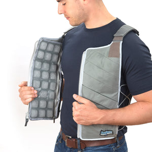 Man putting on Professional series ice vest, charcoal, side view, panels visible