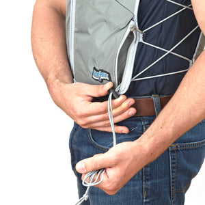 Man wearing FlexiFreeze professional zipper ice vest, charcoal, adjusting sizing strings