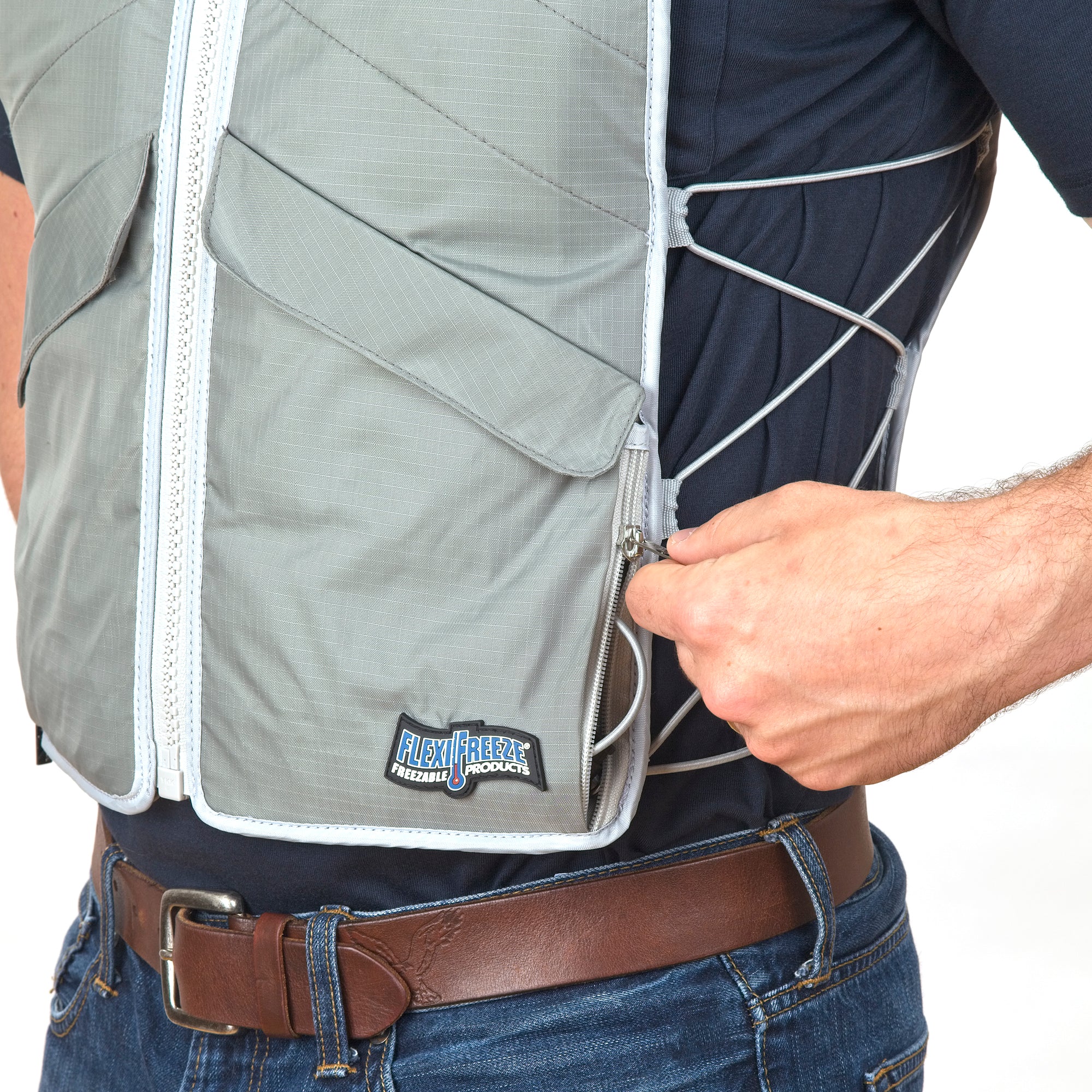 Man wearing FlexiFreeze professional zipper ice vest, charcoal, adjusting sizing strings