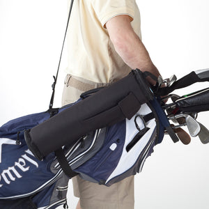 Man with FlexiFreeze refreezable golf bag, black, slung over shoulder with his standard golf bag