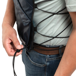 Man wearing FlexiFreeze professional zipper ice vest, navy, adjusting sizing strings