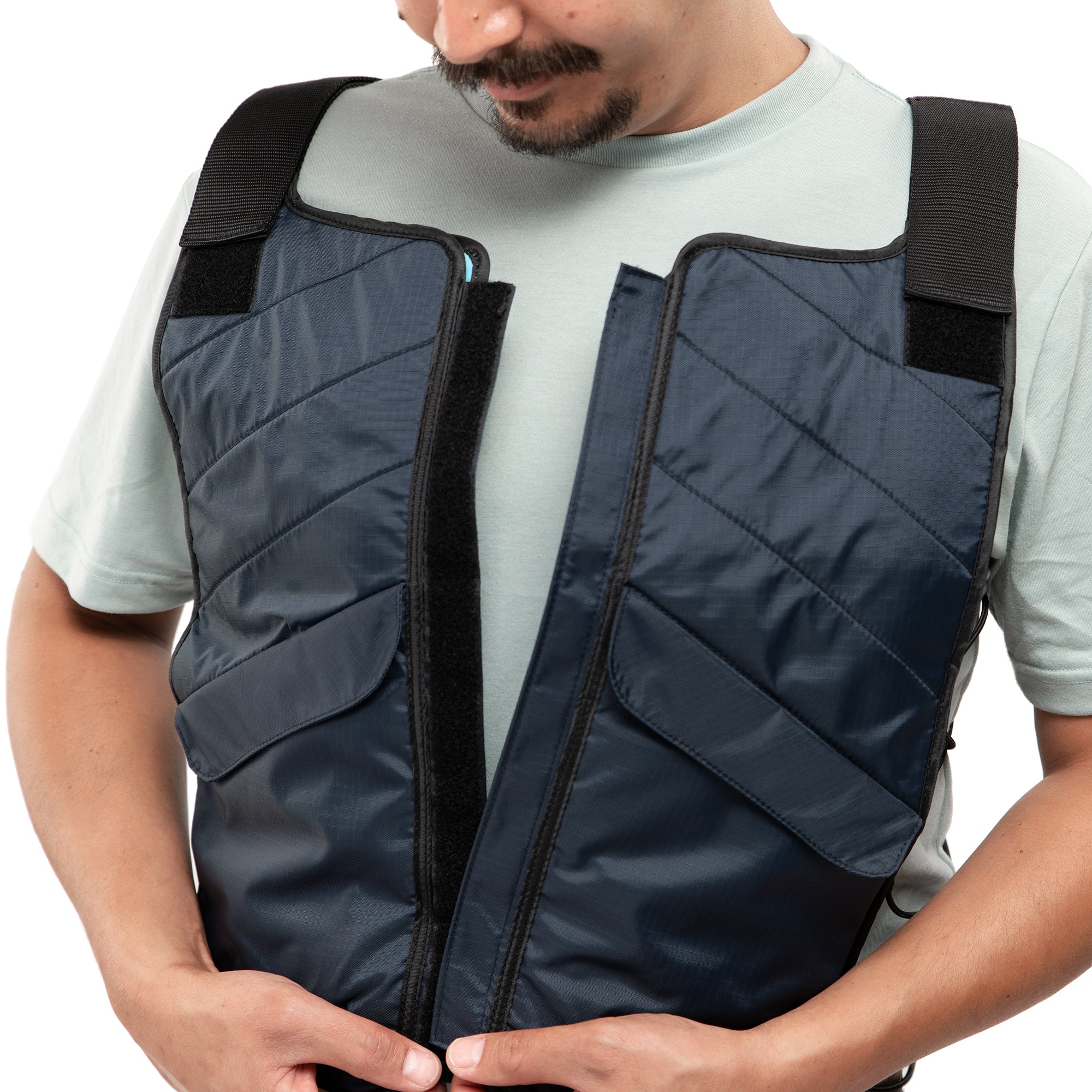 Man putting on FlexiFreeze Professional Ice vest - blue, velcro