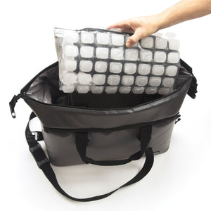 Hand placing FlexiFreeze ice sheet into FlexiFreeze insulated tote bag, large, gray