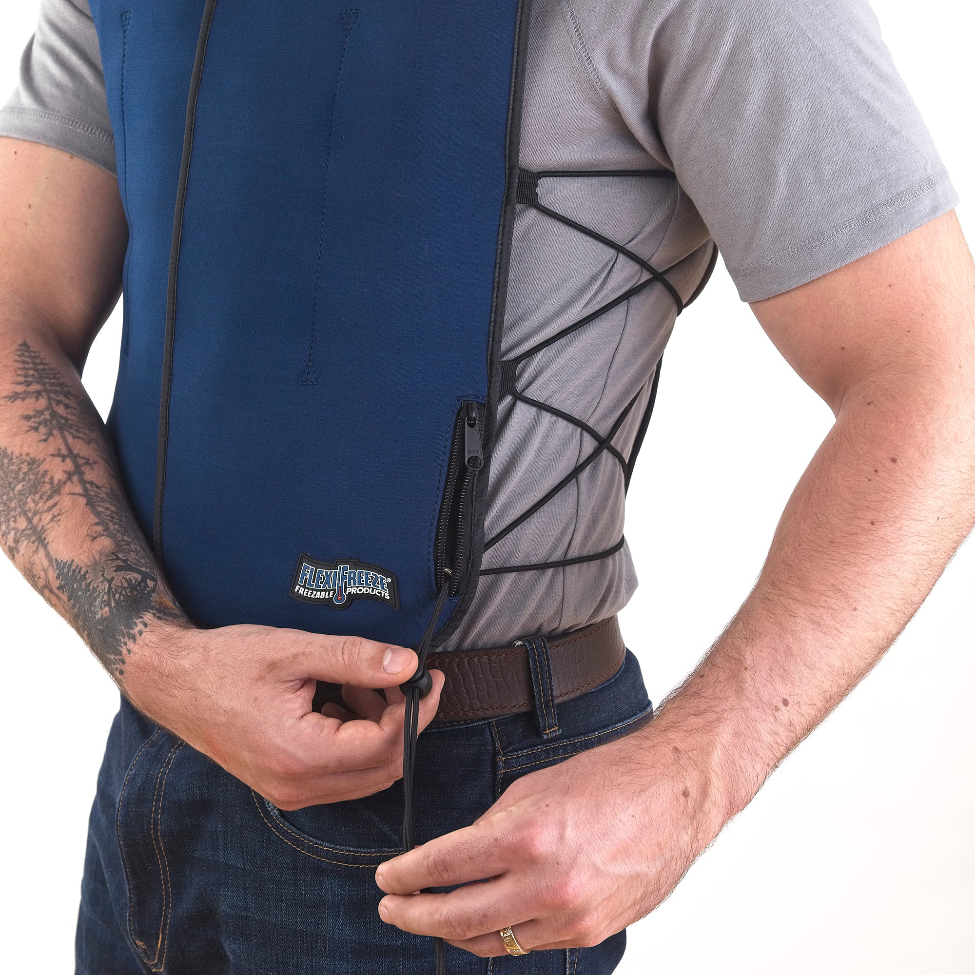 Man wearing FlexiFreeze personal velcro ice vest, blue, adjusting sizing strings
